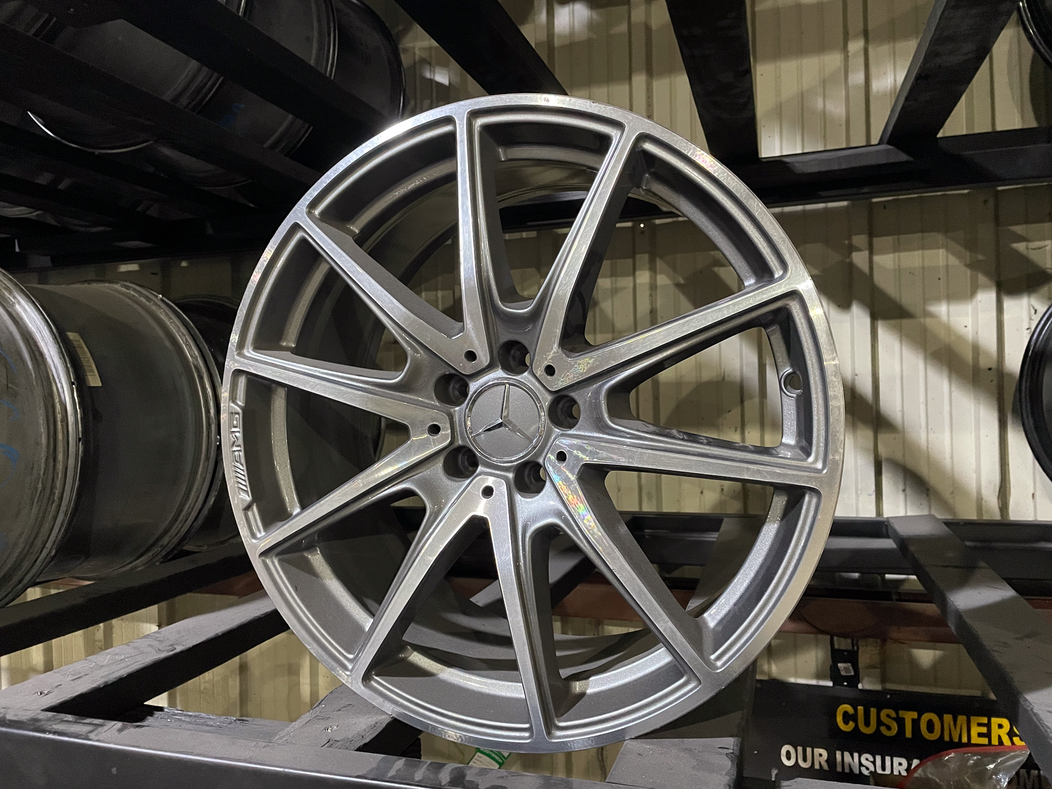 Image of a wheel on display without a tire.