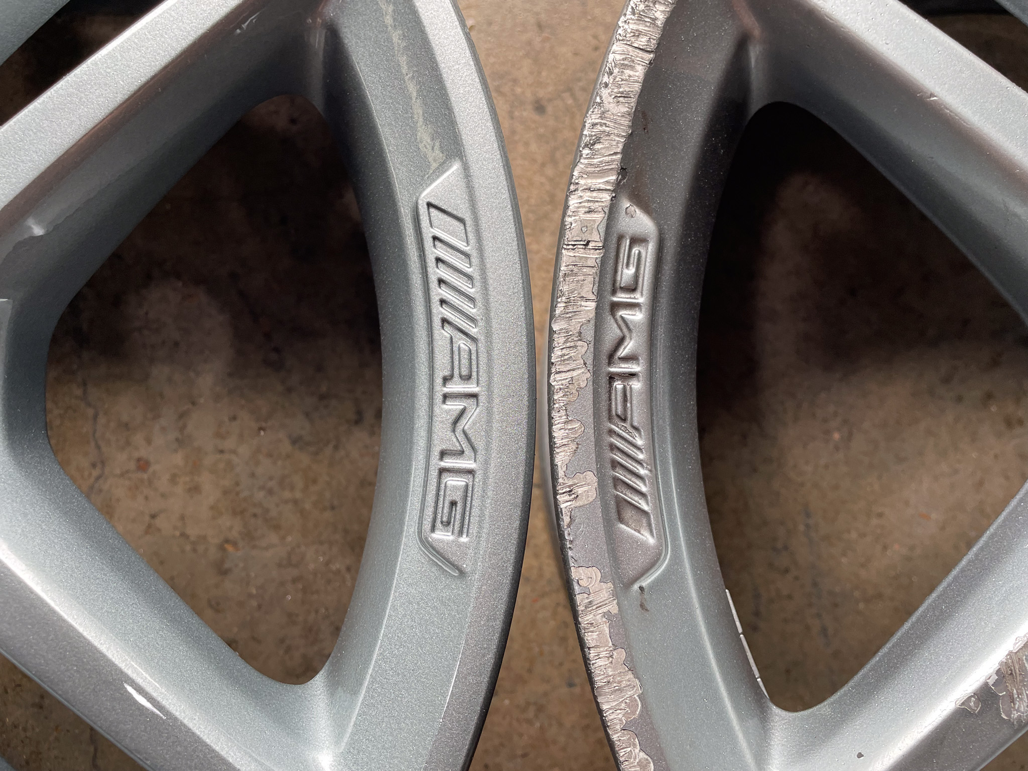 Close up photo comparing a dented and scratched wheel next to a wheel that is brand new after being repaired.