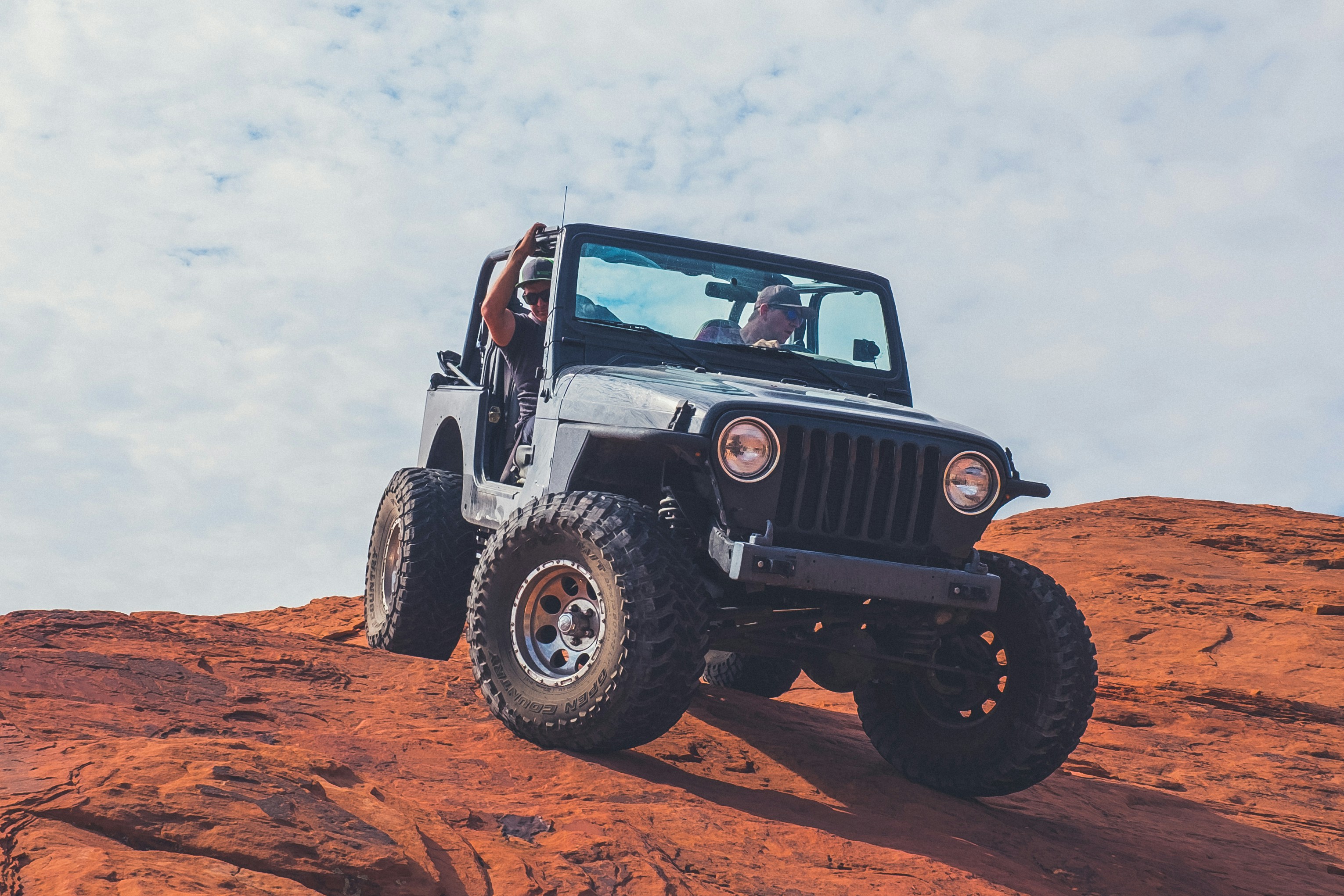 Image of two men off roading in a Jeep car.